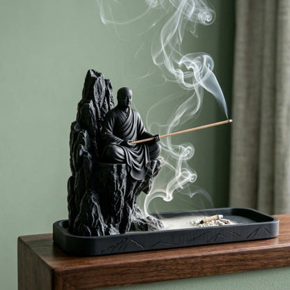 Zen monk incense burner with smoke flowing beside the mountain