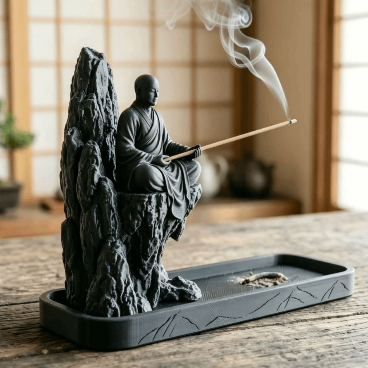 Side view of monk incense holder and long ash-catching tray